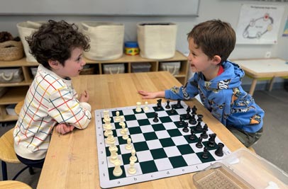 Kindergarten kids playing chess