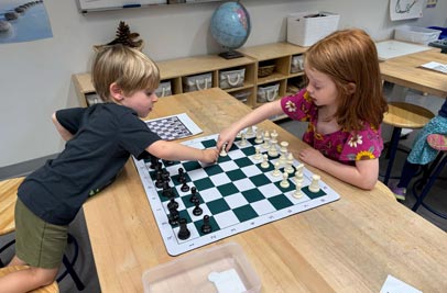 Kindergarten kids playing chess
