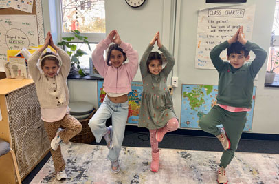 Students at Concord Hill practicing tree pose